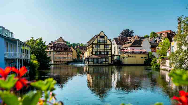 Explore the picturesque canal-side architecture of Bamberg, Germany, under a clear summer sky., tags: euer - pexel