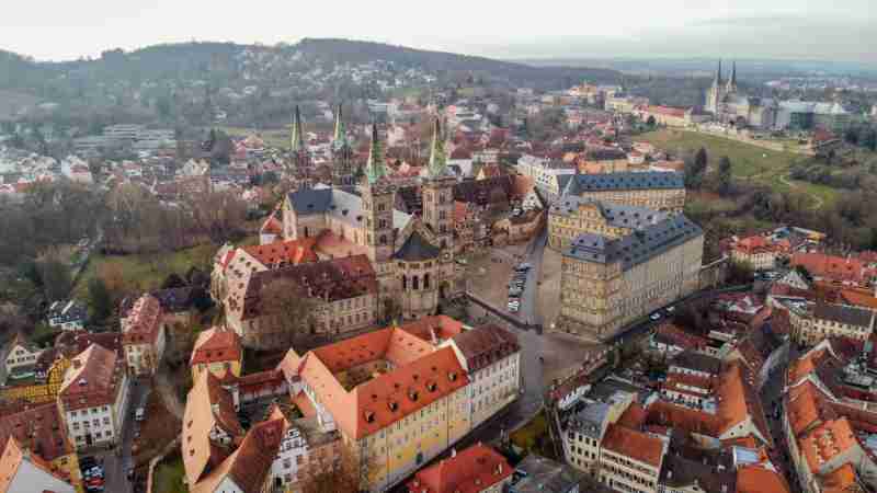 Aerial shot of Bamberg, Germany featuring the historic cathedral and old town buildings., tags: fränkische bis - pexel